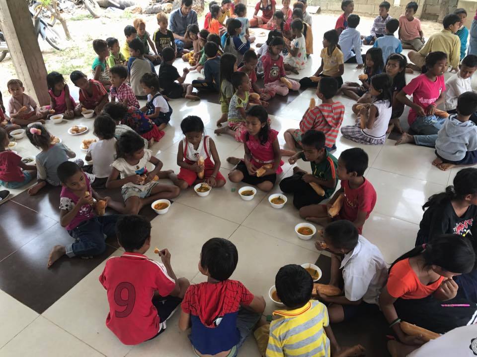 Children during a feeding program activity