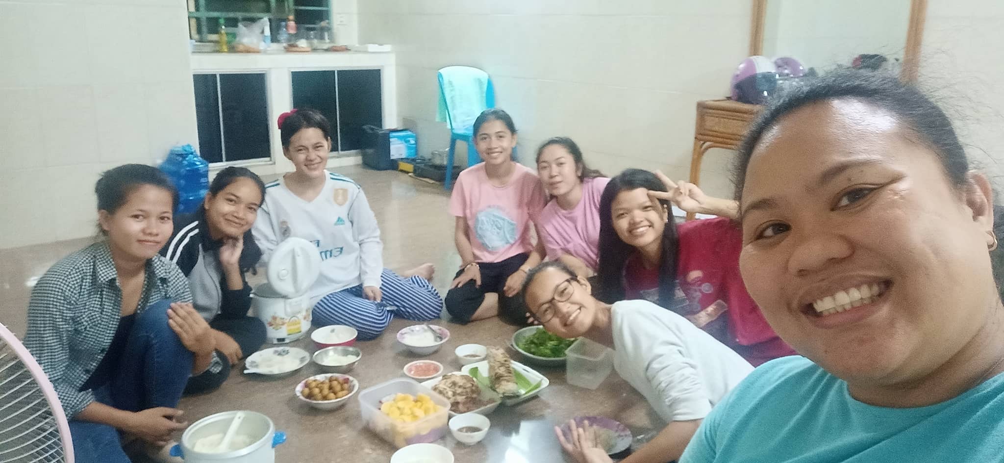 Students in dormitory during monthly dinner fellowship